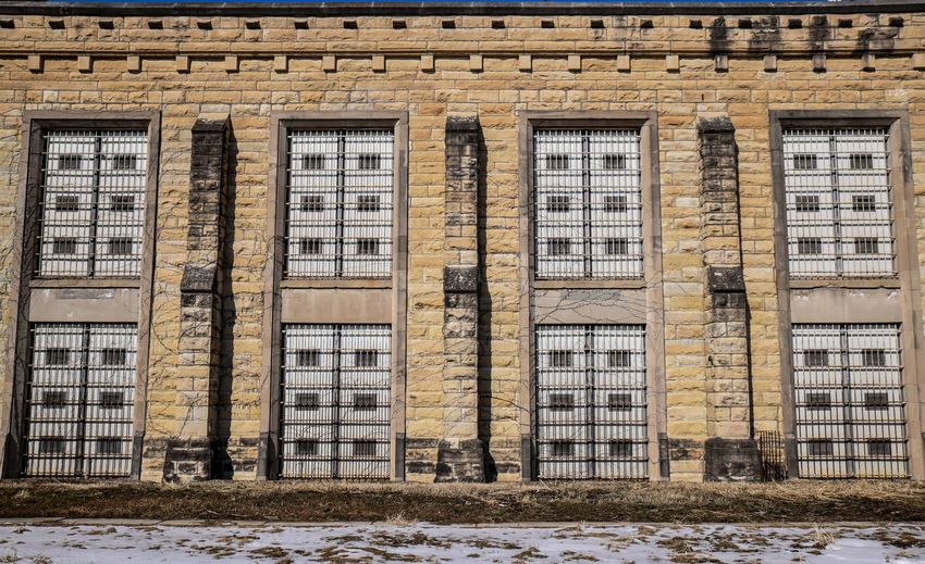 Abandoned prison brick wall and windows