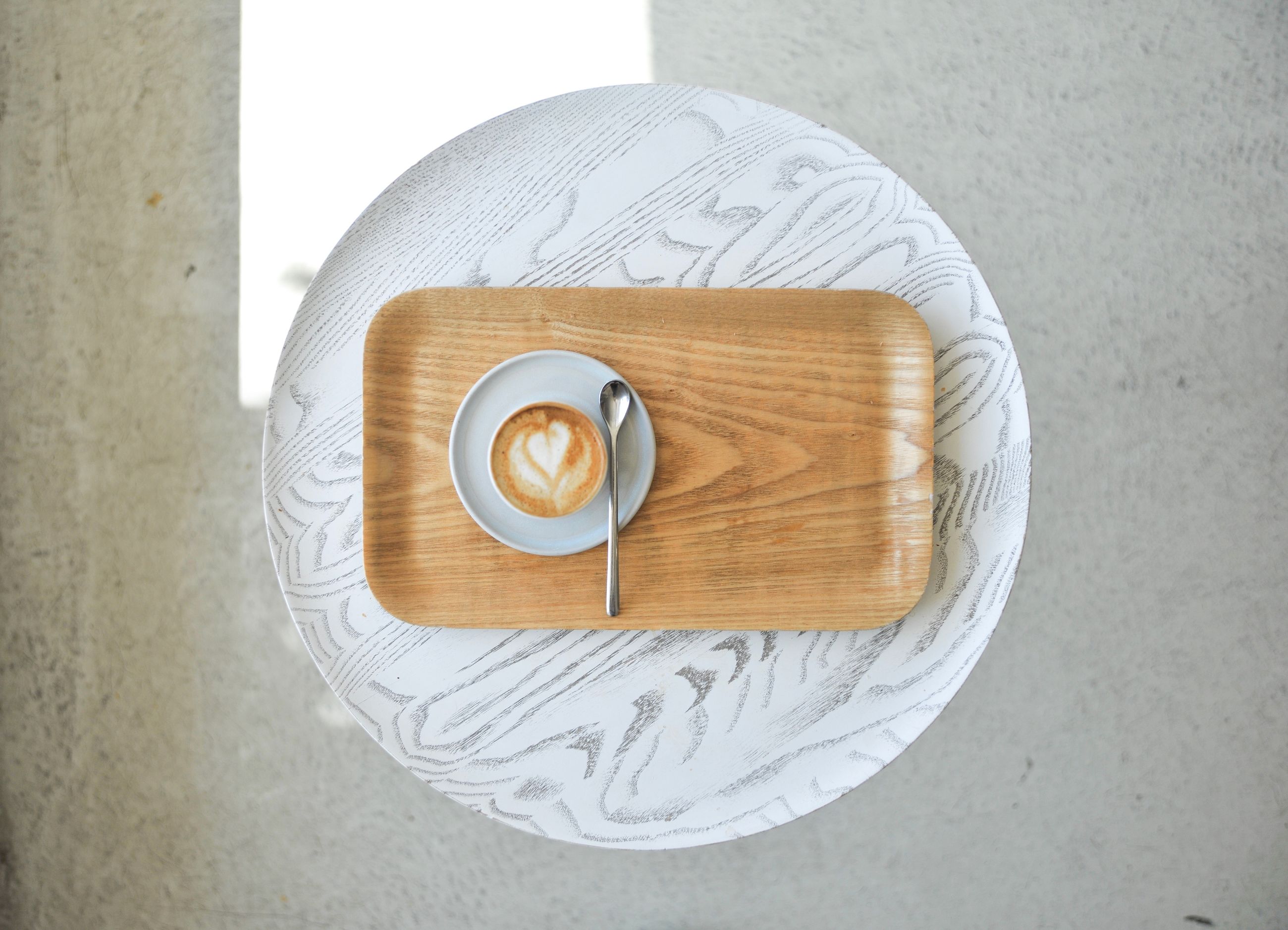 table, directly above, food and drink, still life, drink, cup, coffee cup, indoors, coffee, high angle view, mug, coffee - drink, refreshment, food, freshness, wood - material, no people, frothy drink, close-up, creativity, crockery, latte