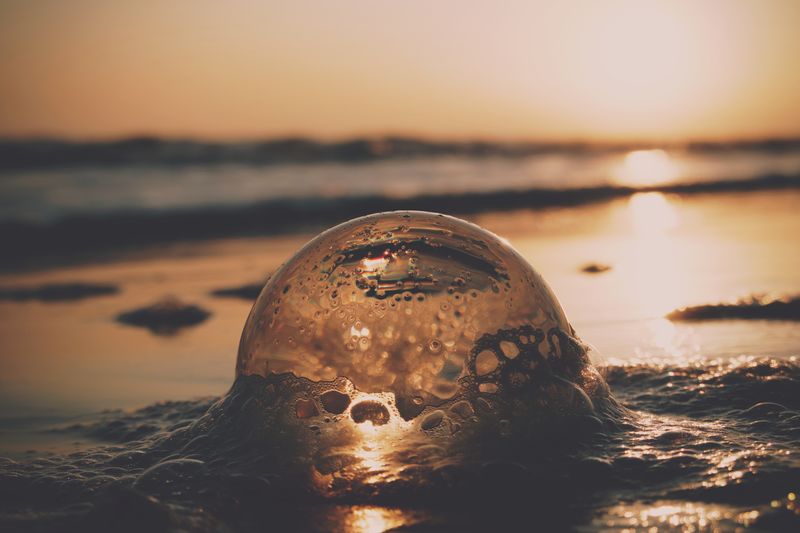 Close-up of sea water during sunset