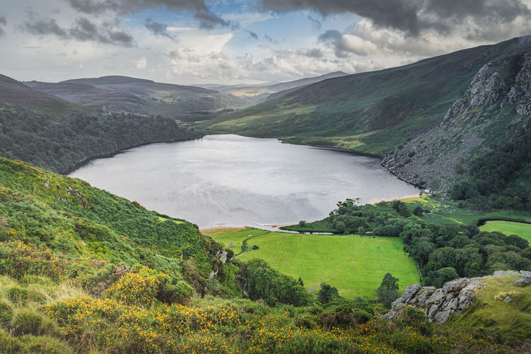 Dramatic sky over lough tay called the guinness lake in wicklow mountains