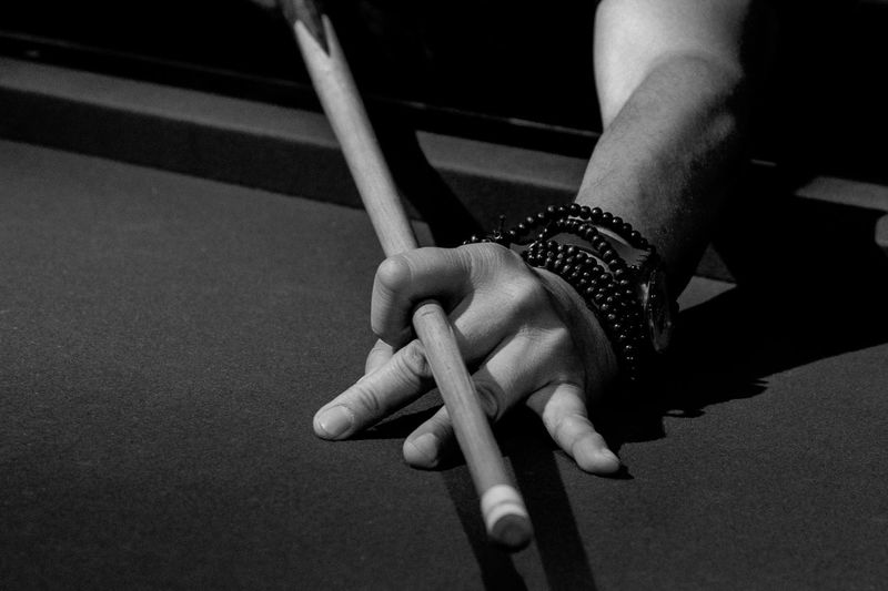 Cropped hand playing snooker