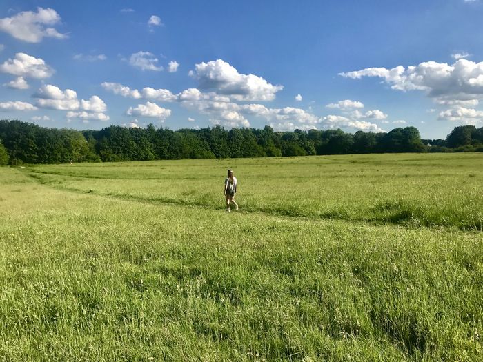 Man working on field against sky