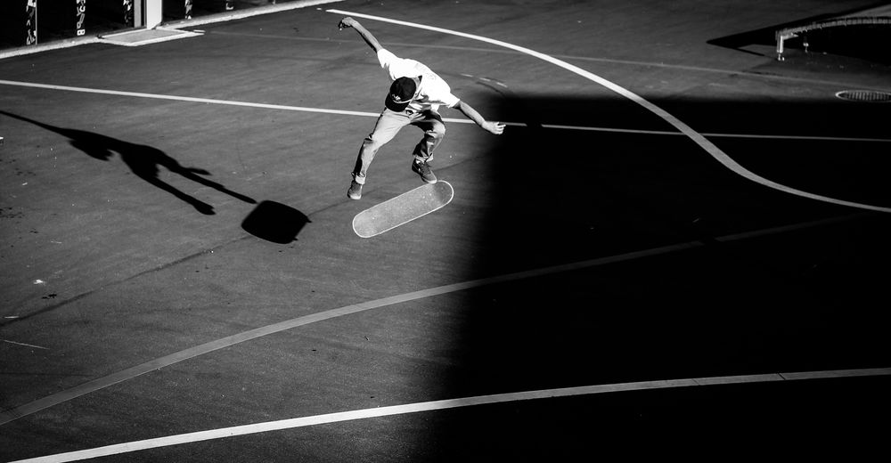 Boy performing stunts in park