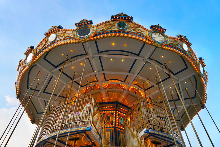 Carousel amusement park with blue sky background