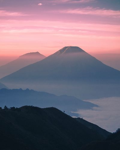 Scenic view of mountain against sky during sunset