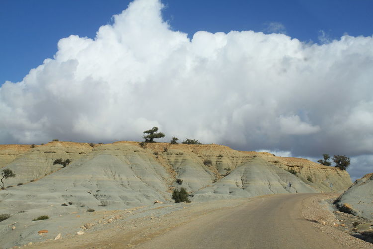 Empty road along rocky landscape