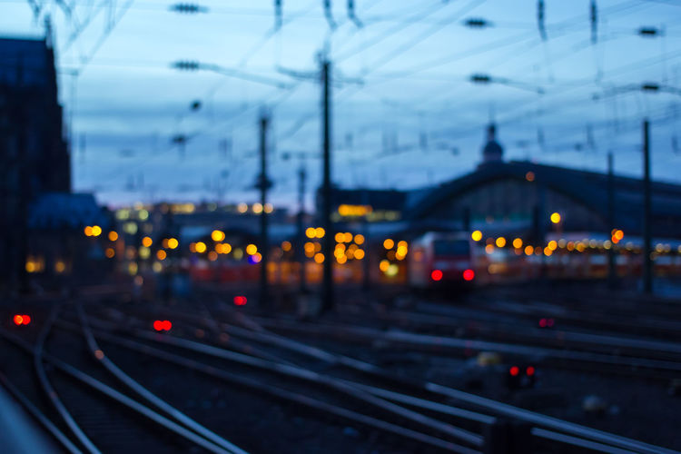 Railroad tracks in city at dusk