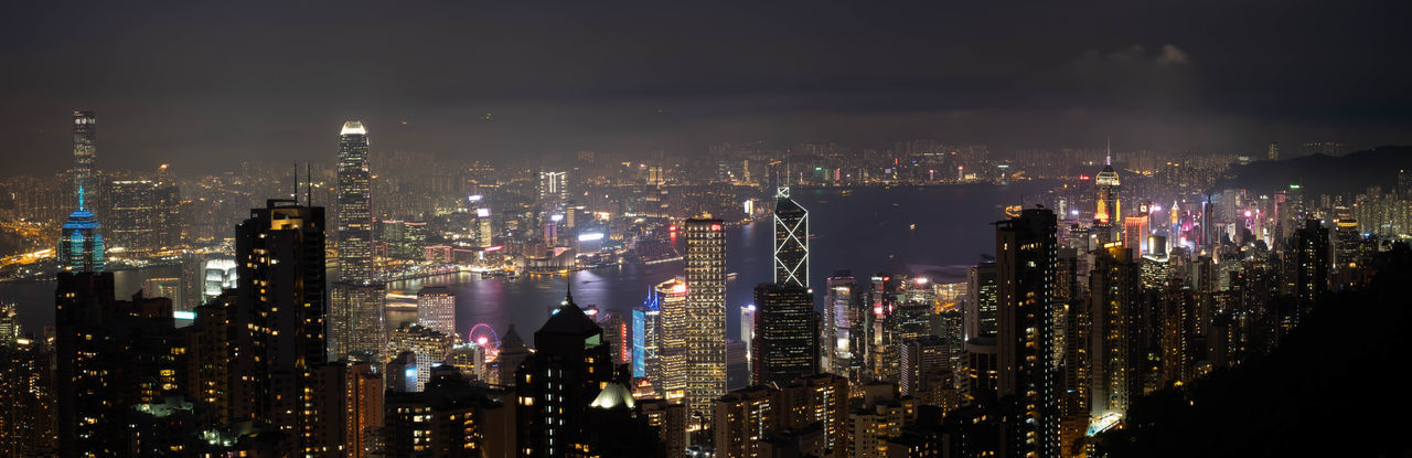 High angle view of illuminated buildings in city at night