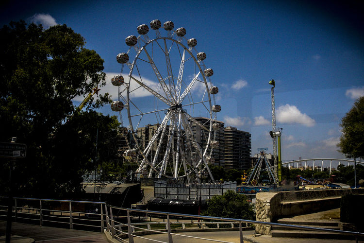 Low angle view of ferris wheel against sky