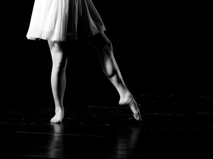 Low section of ballet dancing on stage