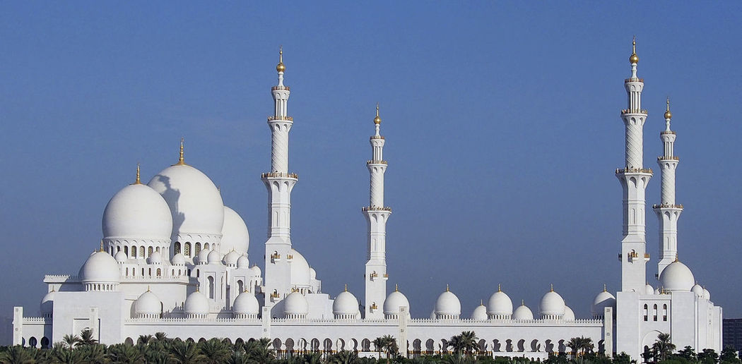 Abu dhabi mosque against clear blue sky