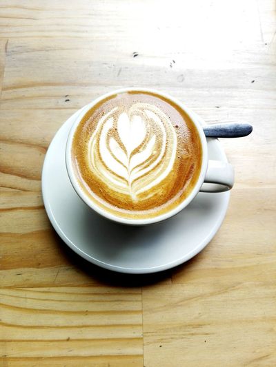 High angle view of cappuccino on table