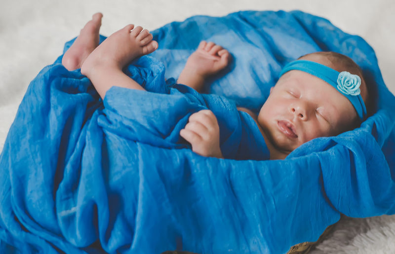Cute baby sleeping in crib at home
