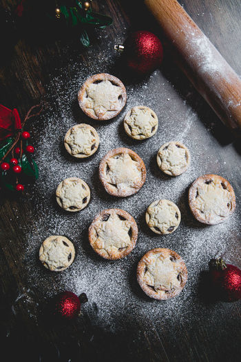 Homemade mince pies arranged in the shape of a christmas tree in  festive food background