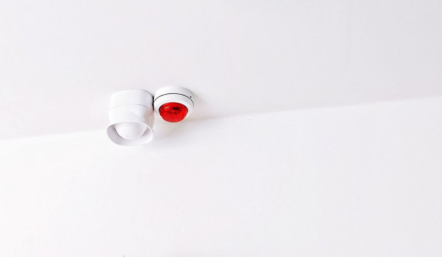 High angle view of red wine on white background