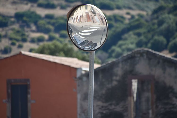 Close-up of road mirror outdoors