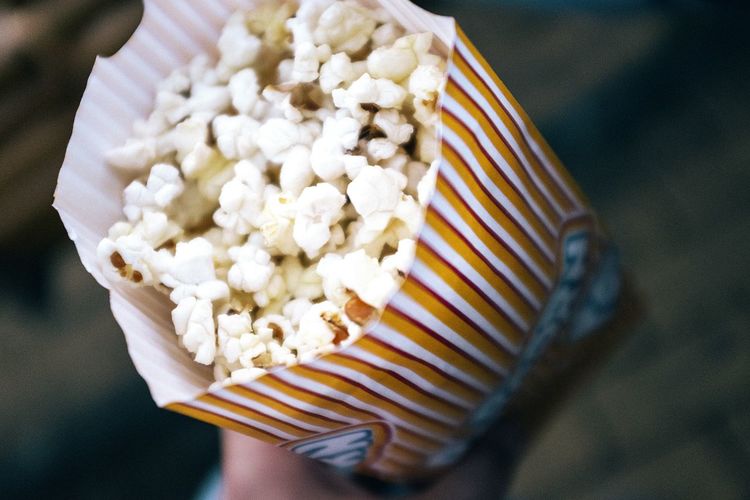 High angle view of popcorn in paper packet