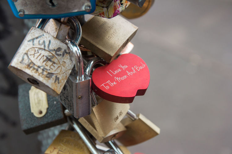 Close-up of love padlocks hanging on metal