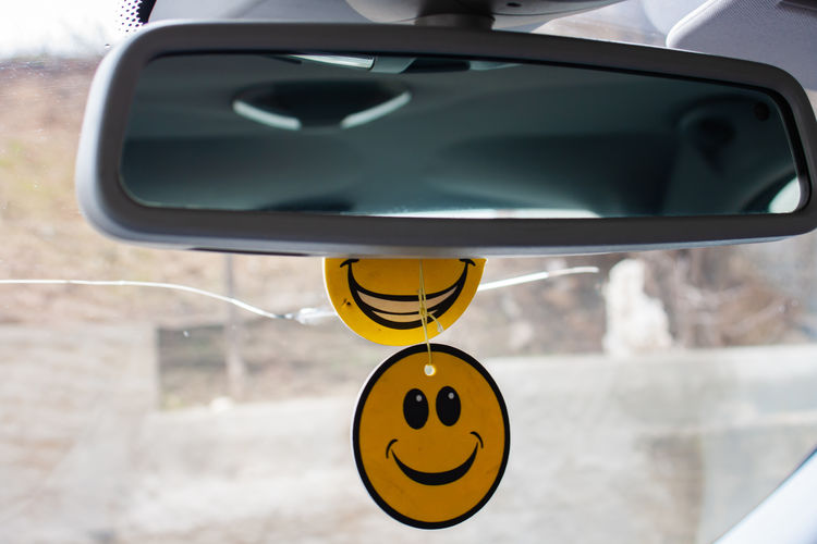 Close-up of information sign on car windshield