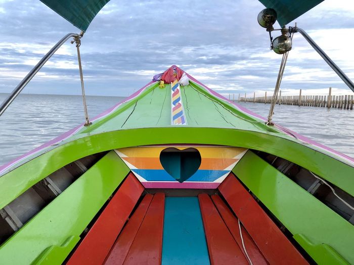 Close-up of sailboat in sea against sky