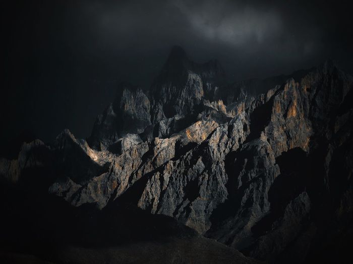 Scenic view of mountain range at night