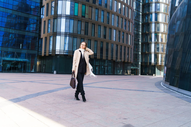Full length of man walking in modern building