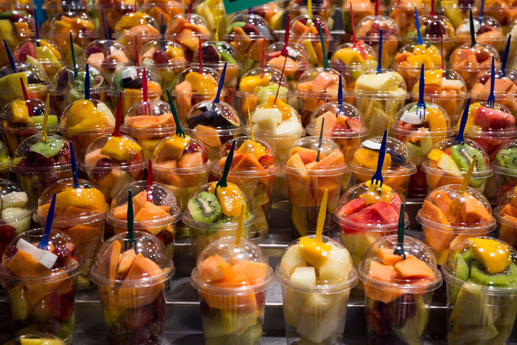 Full frame shot of fruit salad in disposable cups at market