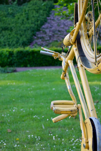 Close-up of bicycle on field