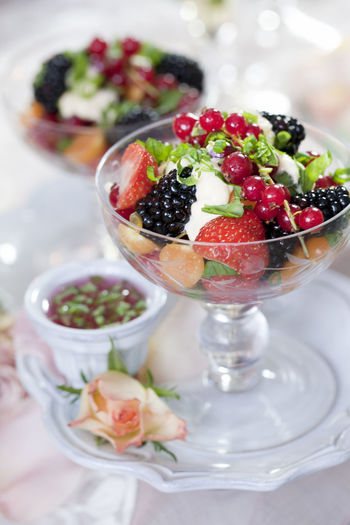 Close-up of fruit salad in glass on table