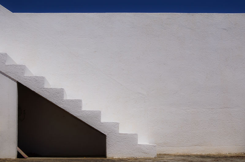 Steps on white wall