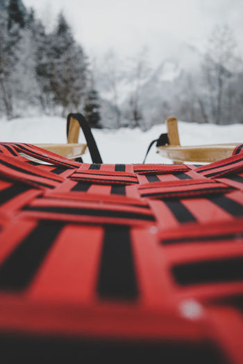 Close-up of empty seats on snow covered plants
