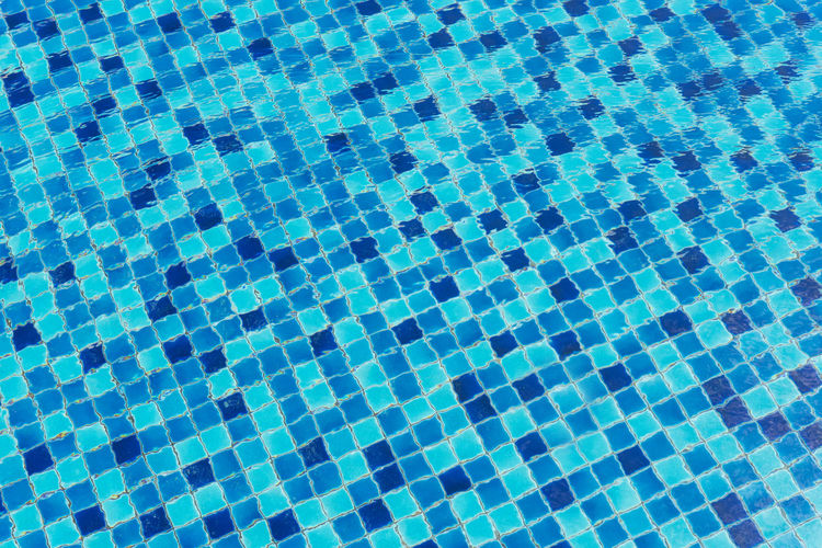 Full frame shot of tiled floor by swimming pool