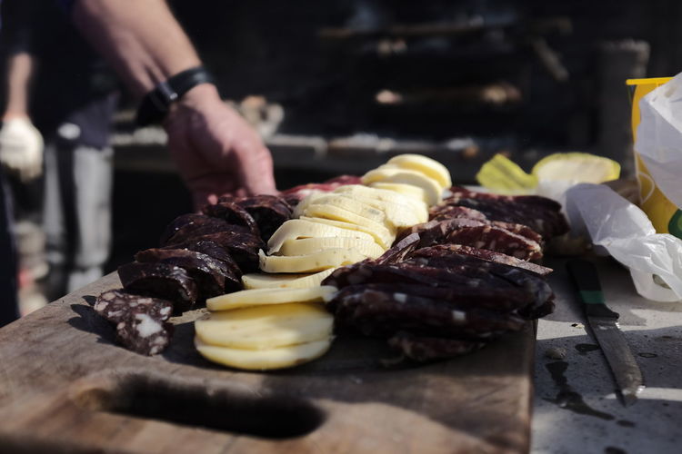Close-up of person preparing food on cutting board