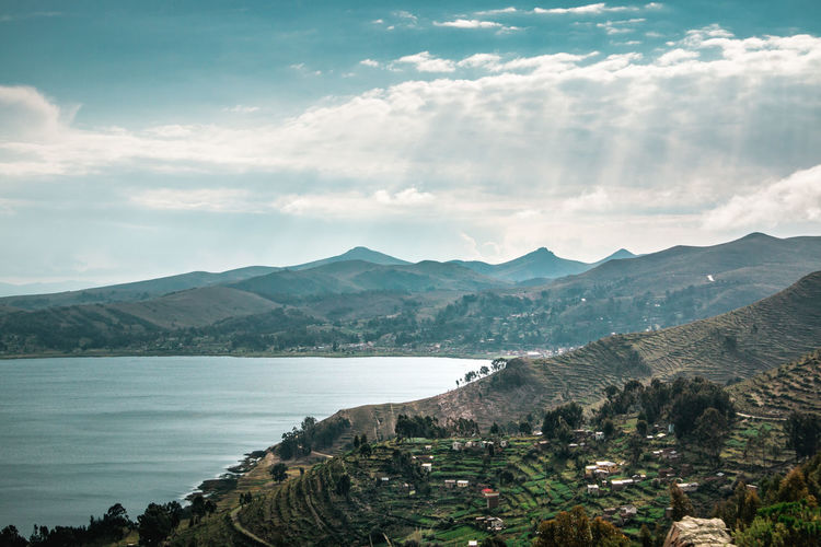 Scenic view of bay against sky
