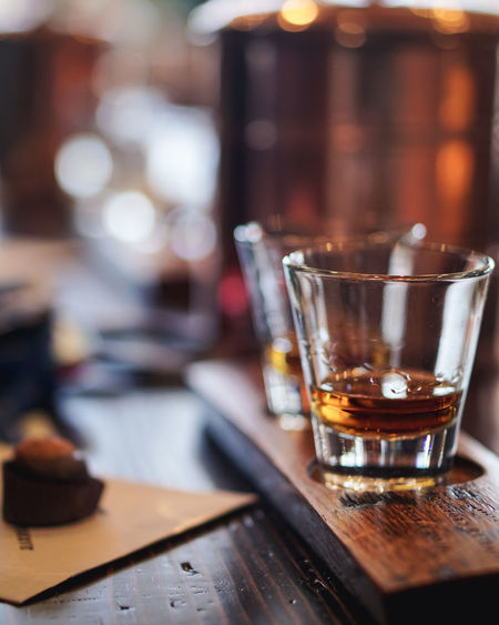 Close-up of whiskey glass on table