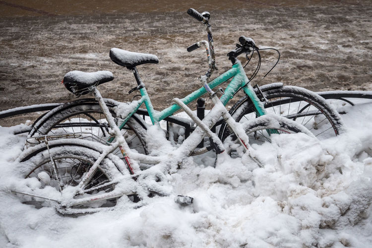 High angle view of abandoned bicycle on snowy field