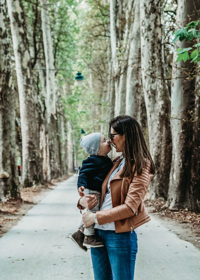 Mother and child love outdoors smiling