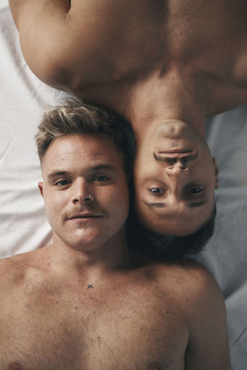 Portrait of two boys with moustaches face to face