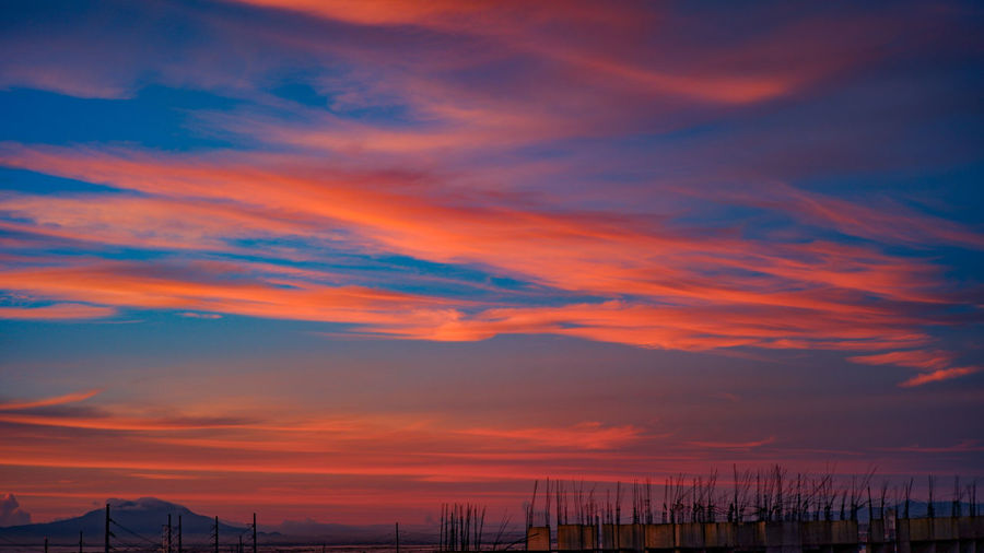 Scenic view of dramatic sky during sunrise
