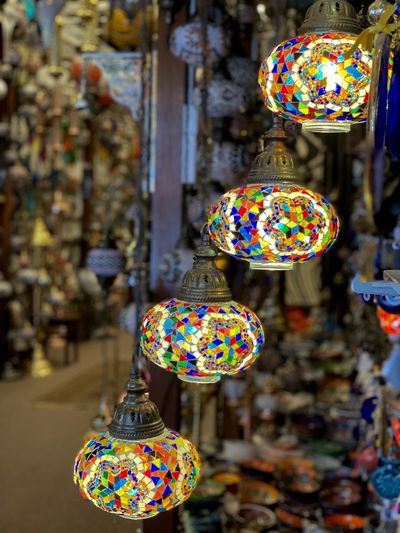Close-up of multi colored lanterns for sale in market