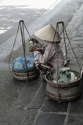 High angle view of an market women. sitting on the street