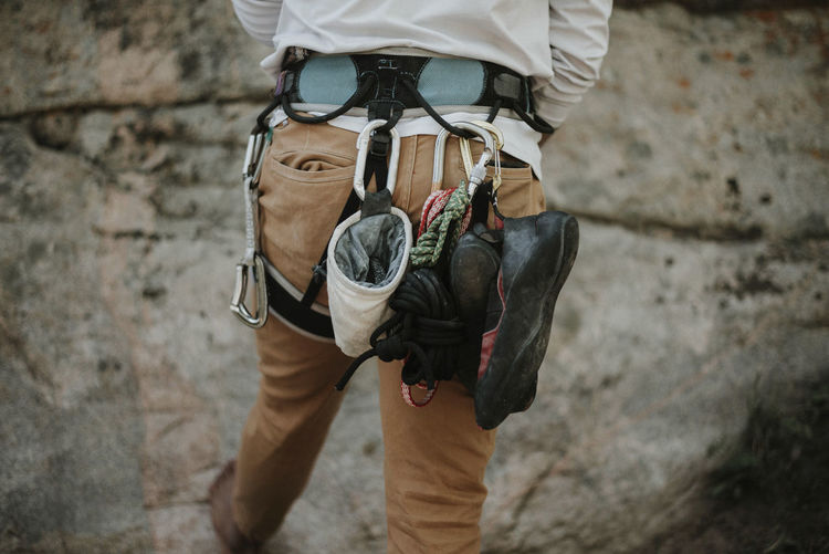 Rear view of man with climbing equipment