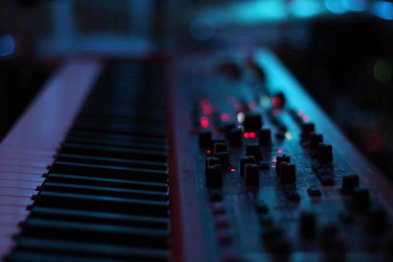 Close-up of piano with sound recording equipment