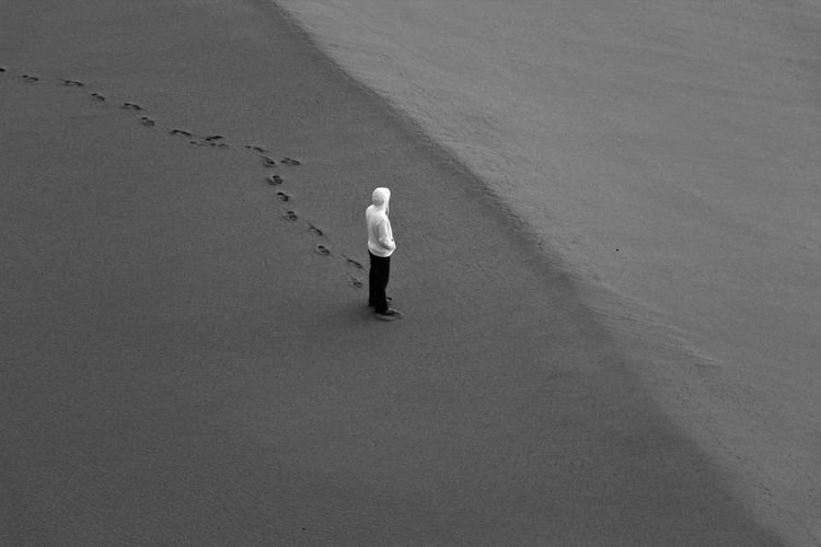 High angle view of man standing at beach