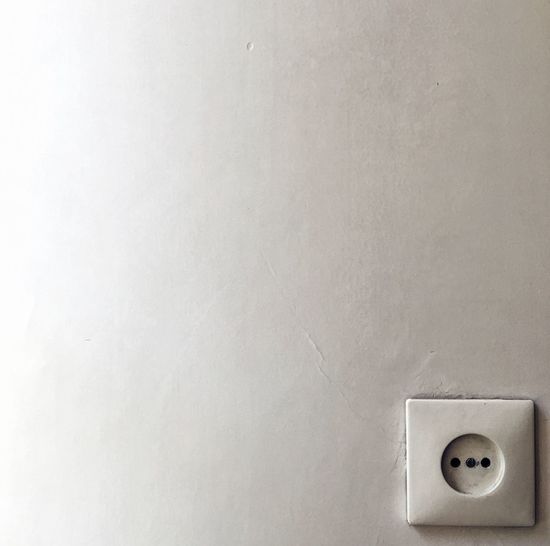 Outlet on white wall
