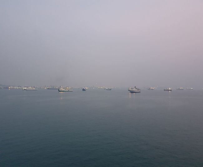 Sailboats in sea against clear sky