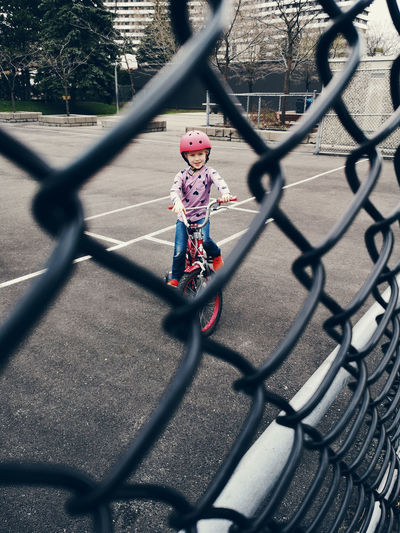 Girl riding bicycle in court
