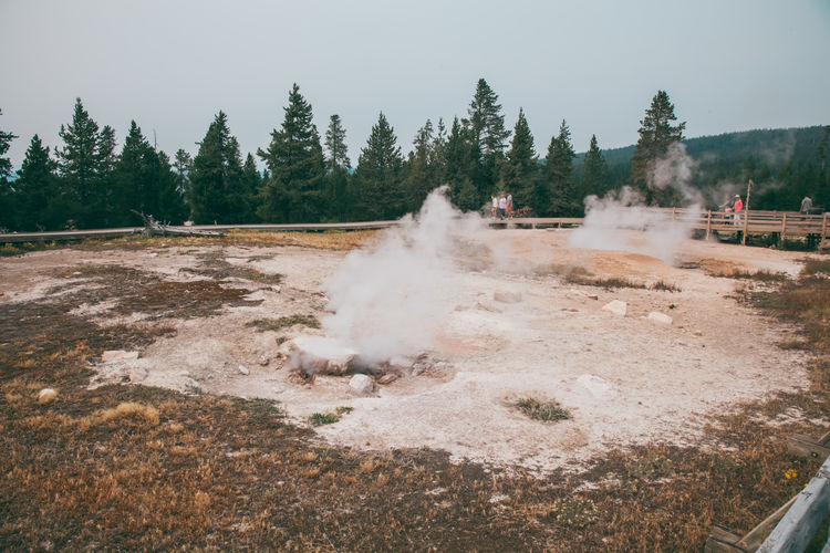 Epic scenic view over colorful geyser in yellowstone national park.