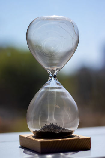 Close-up of hourglass on table