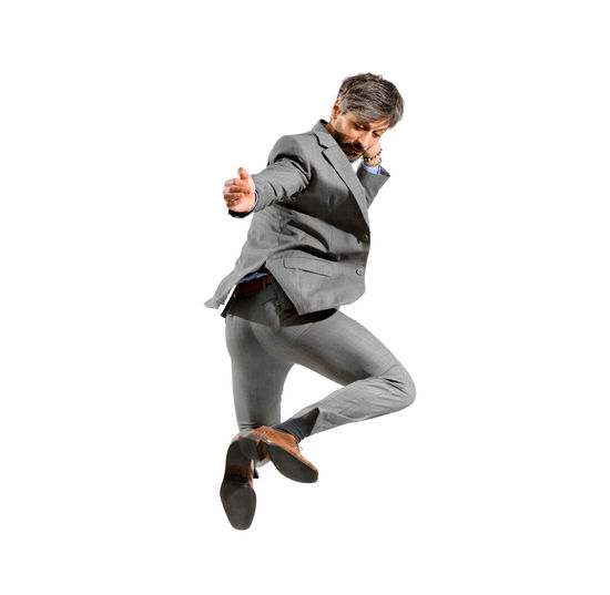 Full length of a man jumping over white background